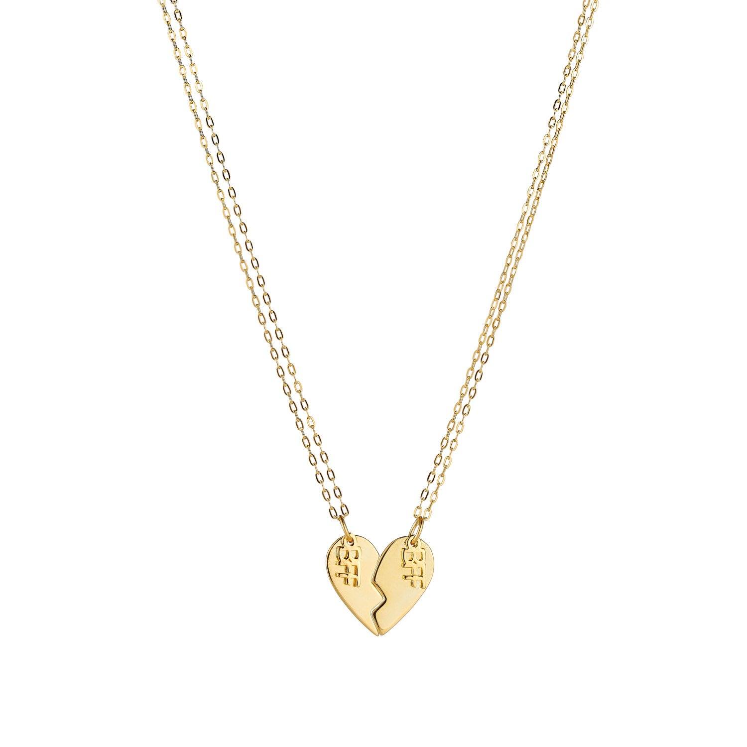 Product image of a pair of sterling silver best friend necklaces, with 14k gold plating, that when put together, make the shape of a heart. Each side of the heart has a charm attached with the word 'BFF'.